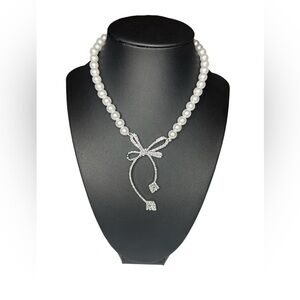 Beautiful faux pearl necklace with silver color bow